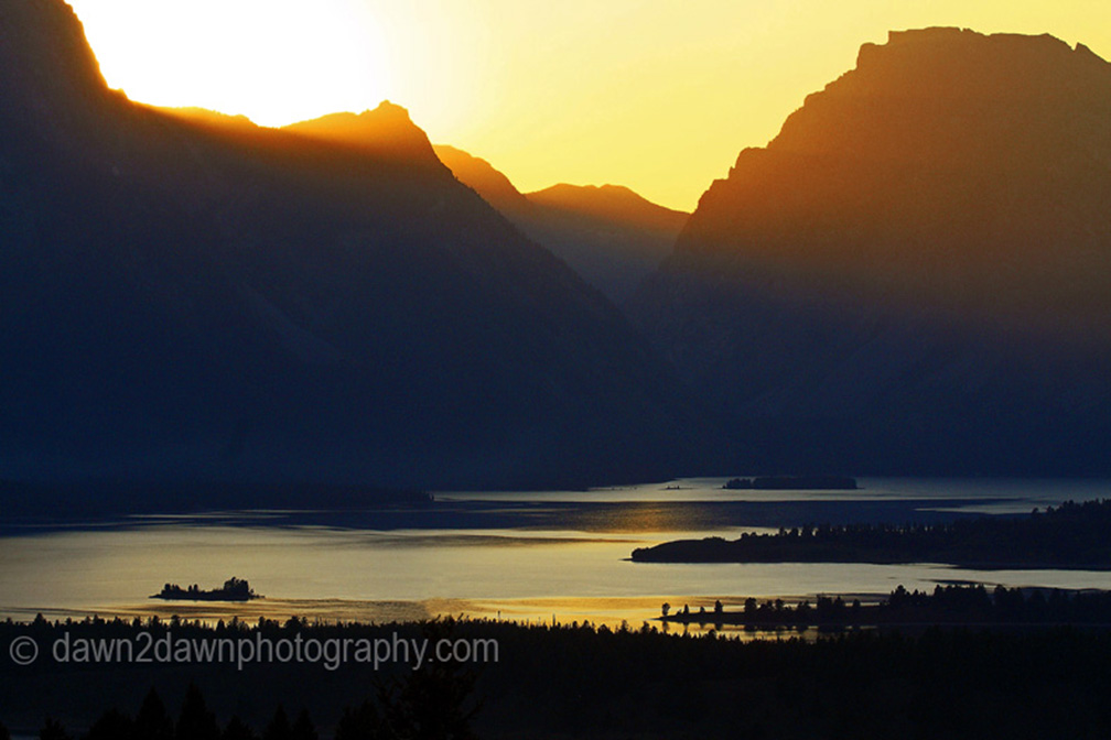SUNSET OVER THE TETONS AND JACKSON LAKE