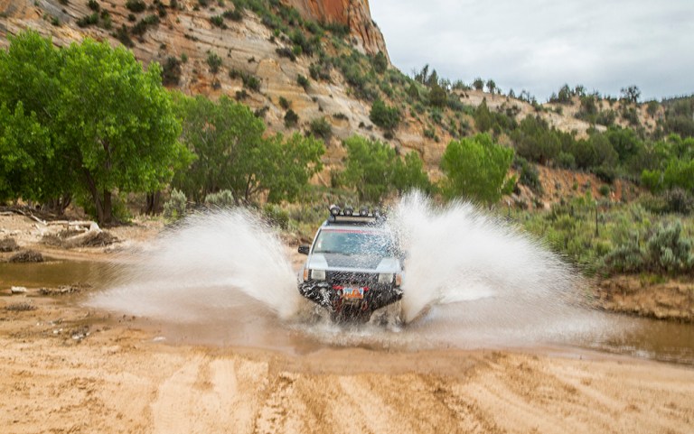 A four Wheel Drive Vehicle Fords The East ork Of The Virgin River in Southern Utah