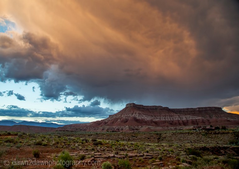 Storm clouds hover over Hurricane Mesa near Zion National Park, Utah