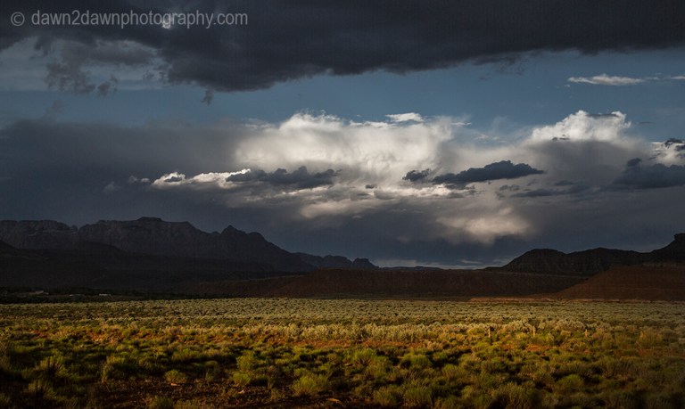 Storm clouds hover over the landscape near Zion National Park, Utah