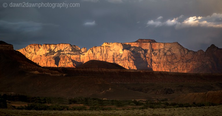 The sun sets on West Temple at Zion National Park, Utah