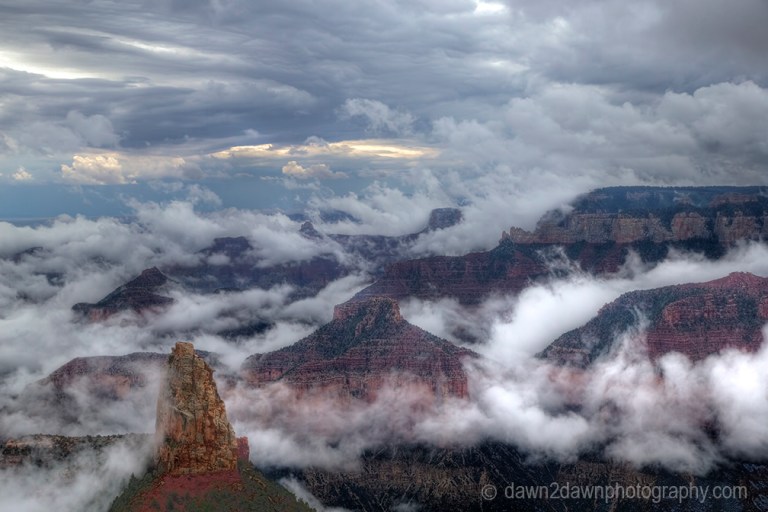 Fog lifts from the Bottom of The Grand Canyon from Point Imperial at Grand Canyon National Park, Arizona