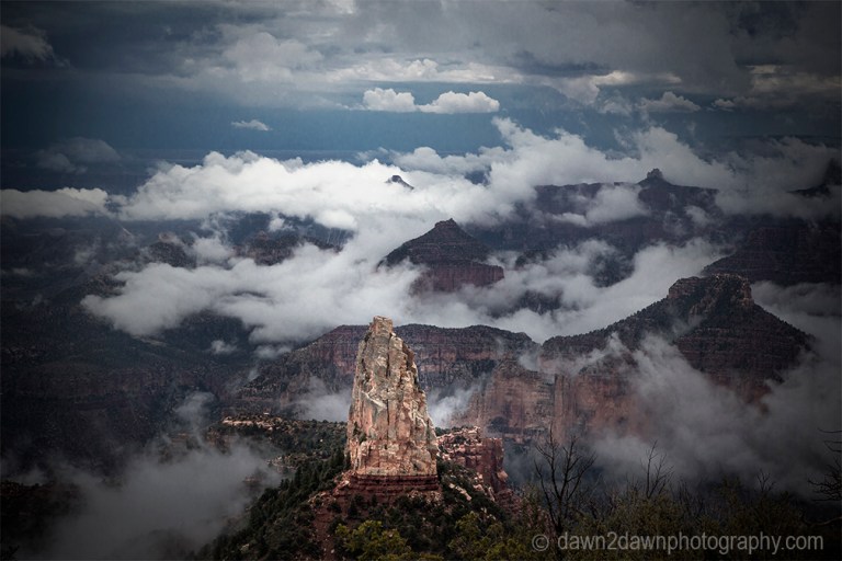 Fog lifts from the Bottom of The Grand Canyon from Point Imperial at Grand Canyon National Park, Arizona