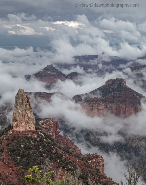 Fog lifts from the Bottom of The Grand Canyon from Point Imperial at Grand Canyon National Park, Arizona