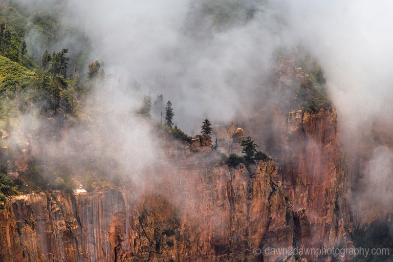 Fog rises from the depths of the Grand Canyon near Cape Royal at Grand Canyon National Park, Arizona