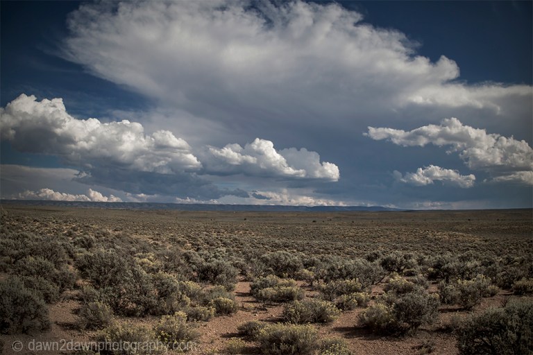 Storm clouds appear over the Northern Arizona landscape.
