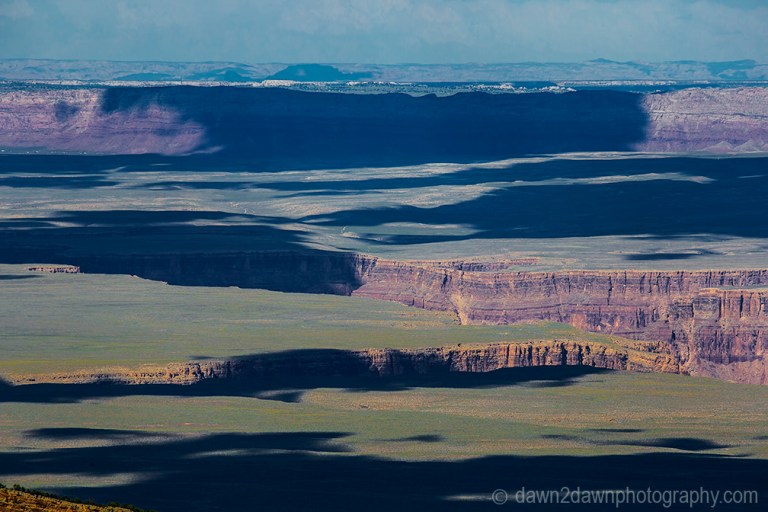 Passing clouds produce shadows on the landscape around Marble Canyon in Northern Arizona