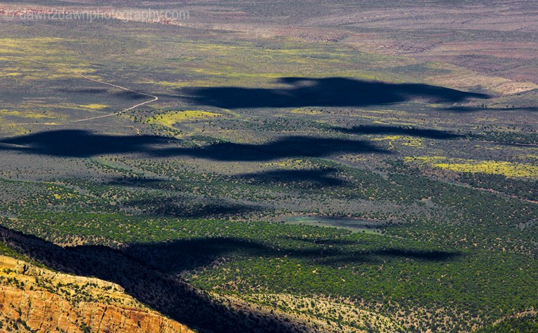 Passing clouds produce shadows on the landscape around Marble Canyon in Northern Arizona