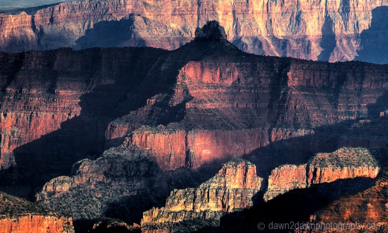 The settting sun forms shadows on the Grand Canyon at Point Imperial