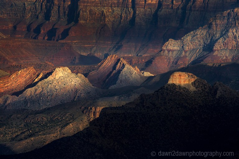 The settting sun forms shadows on the Grand Canyon at Point Imperial