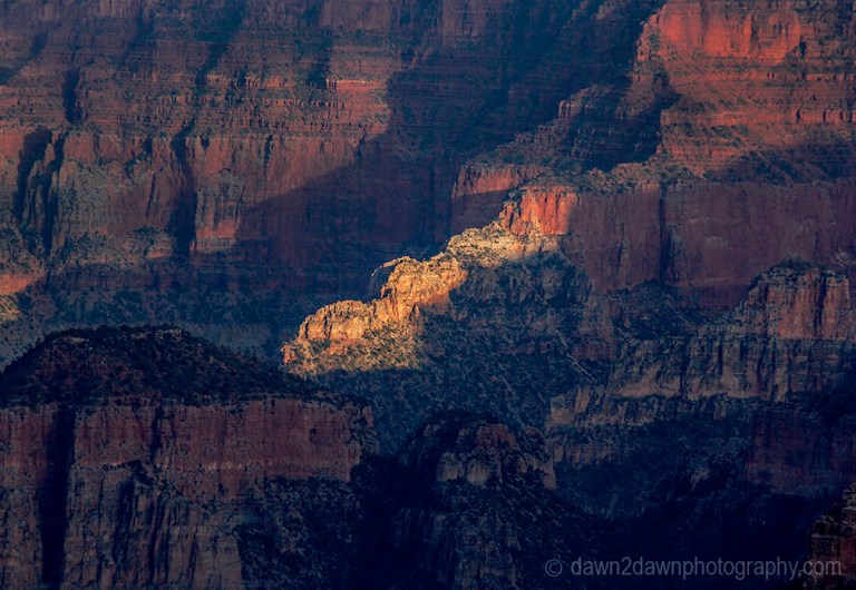 The settting sun forms shadows on the Grand Canyon at Point Imperial