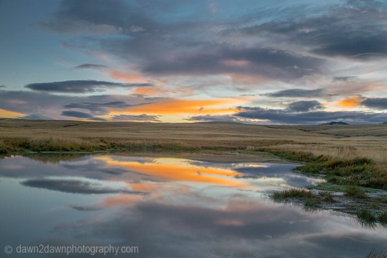 The sun sets on a pond at Kolob Terrace, near Zion National Park, Utah