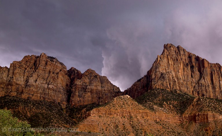 A storm approaches Zion National Park through The Watchman in Southern Utah