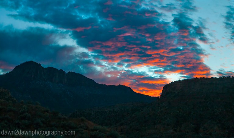 The sun sets over a mesa in Southern Utah
