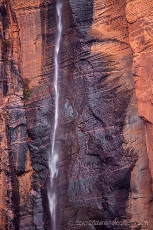 A seasonal waterfall flows from the top of Zion Canyon at Zion National Park, Utah