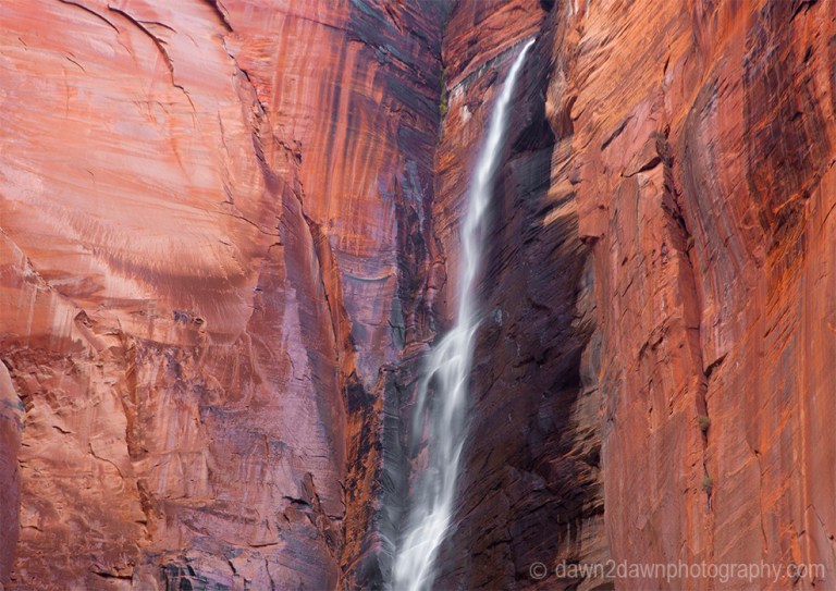 A seasonal waterfall flows from the top of Zion Canyon at Zion National Park, Utah