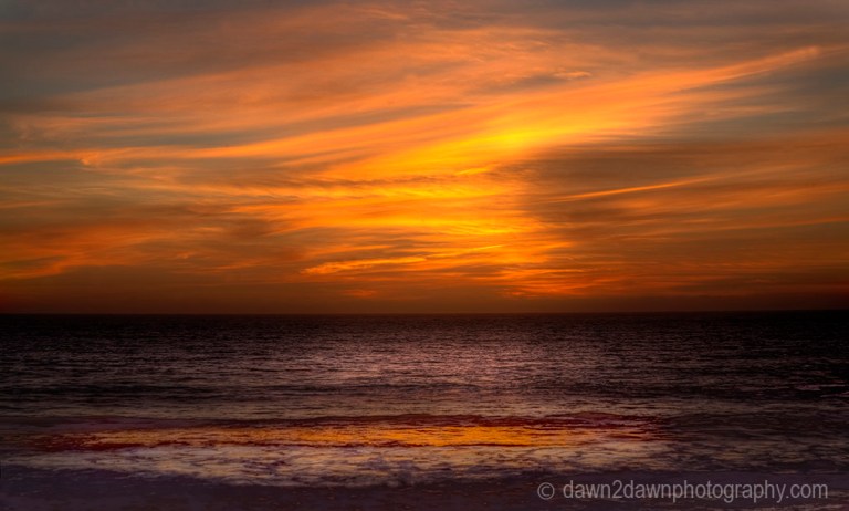 The sun sets over the Pacific Ocean near Big Sur, California