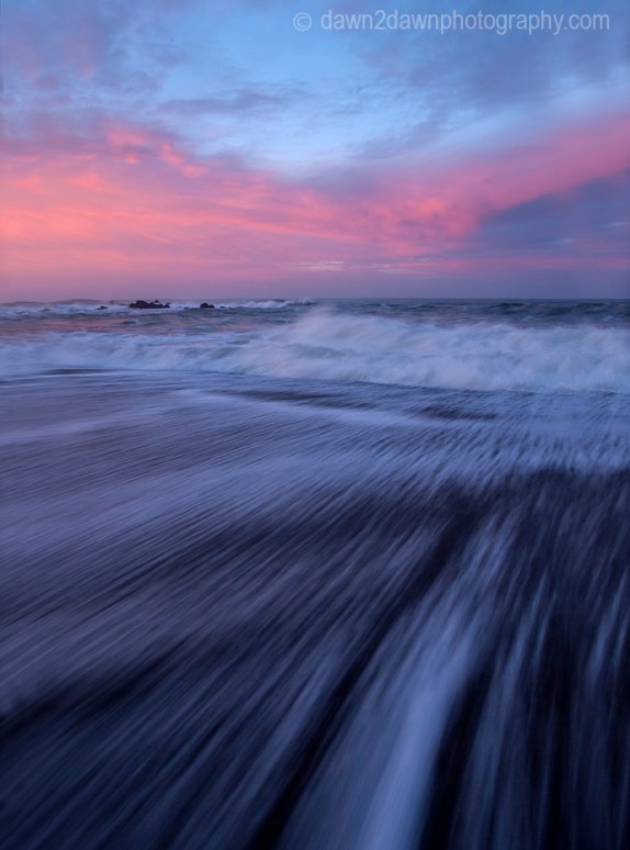 The sun rises over the Pacific Ocean at Cambria, California