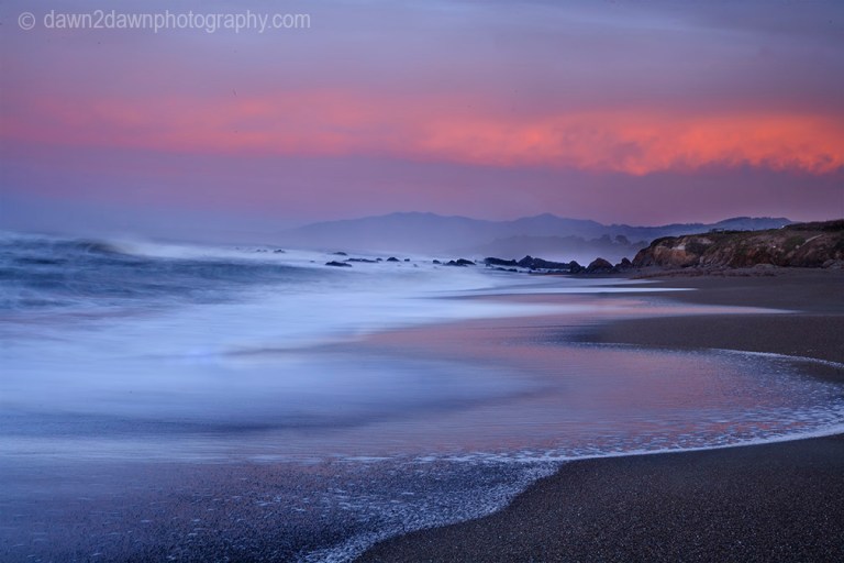 The sun rises over the Pacific Ocean at Cambria, California