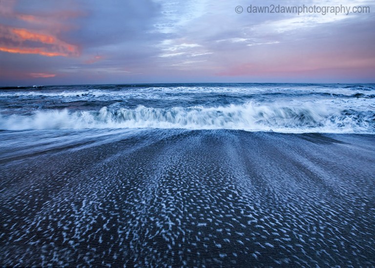 The sun rises over the Pacific Ocean at Cambria, California