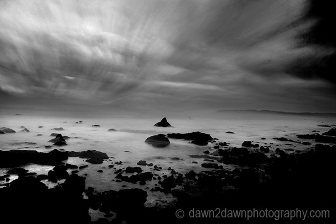 The sun sets over the Pacific Ocean at Cambria, California