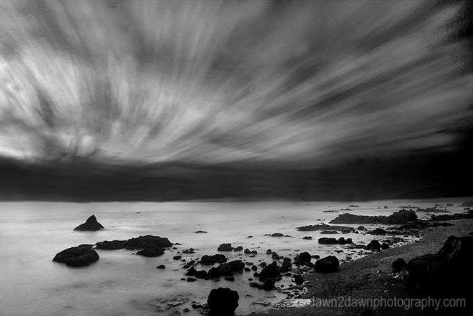 The sun sets over the Pacific Ocean at Cambria, California