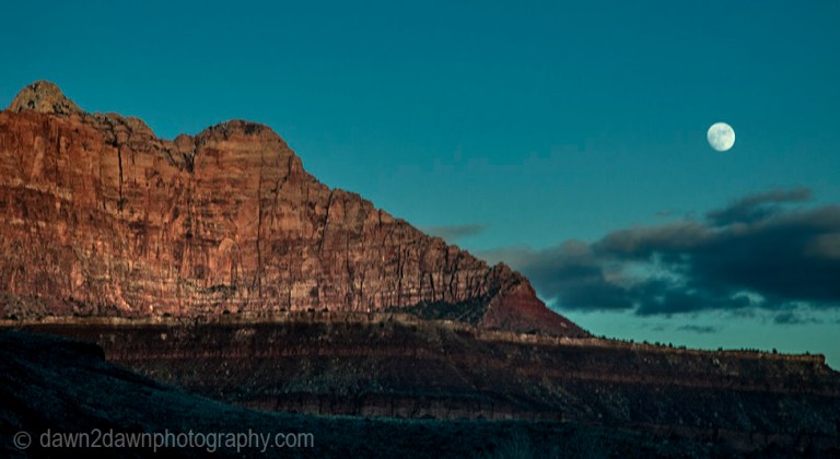 A full moon rises over the rim of Zion Canyon at Zion National Park,Utah