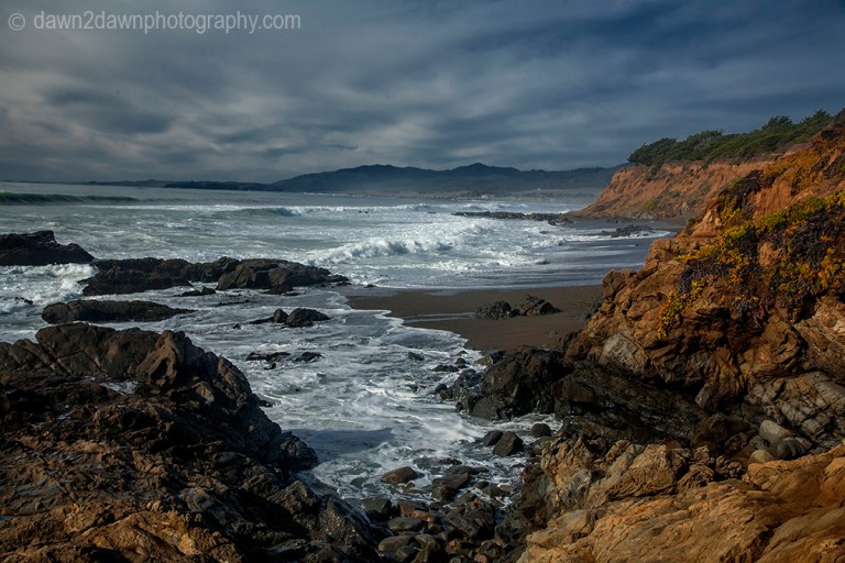 The sun sets over the Pacific Ocean at Cambria, California