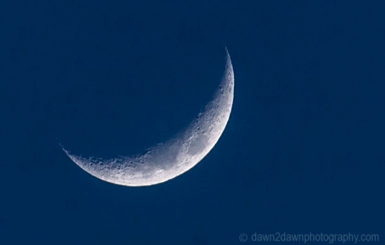 Closeup of a partial moon rising over California