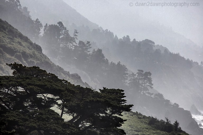 Fog rolls into the highlands along California's Pacific Ocean Coast at Big Sur.