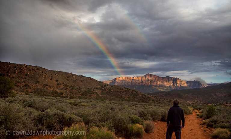A passing thunderstorm produces a rainbow at Zion National Park, Utah
