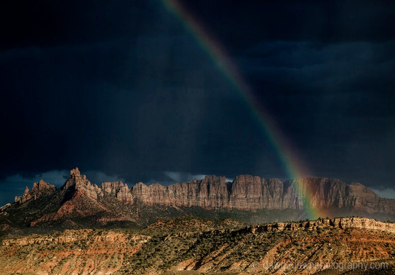 A rainbow appears during a thunderstorm at Eagle Crags near Zion National Park, Utah