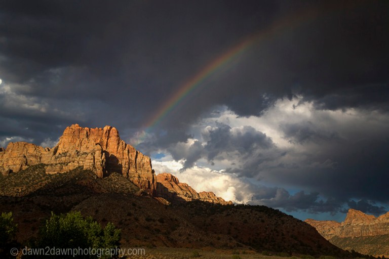 A rainbow appears during a thunderstorm at Zion National Park, Utah