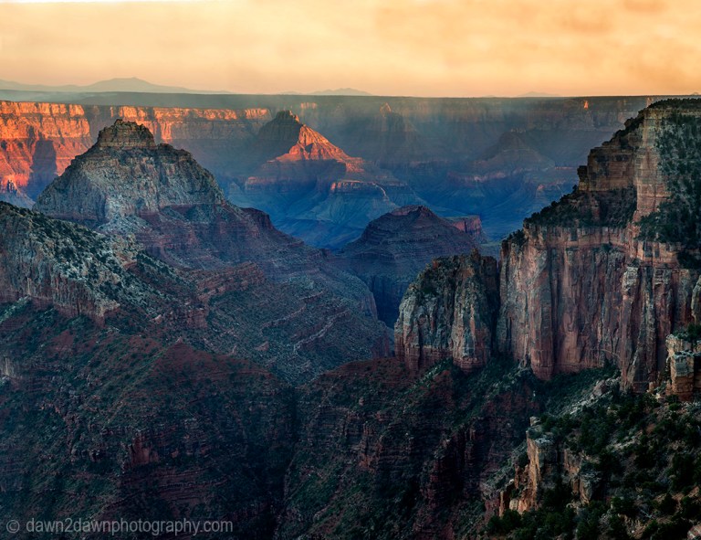 The sun sets on the Grand Canyon as seen from The North Rim at Grand Canyon National Park, Arizona
