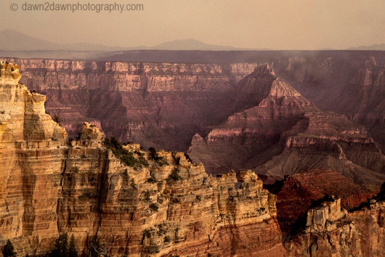 The sun sets on the Grand Canyon as seen from The North Rim at Grand Canyon National Park, Arizona