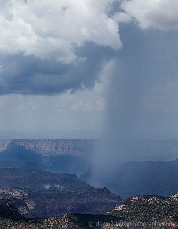 Storm clouds pass over the Grand Canyon as seen from Timp Point, Kaibab National Forest, Arizona