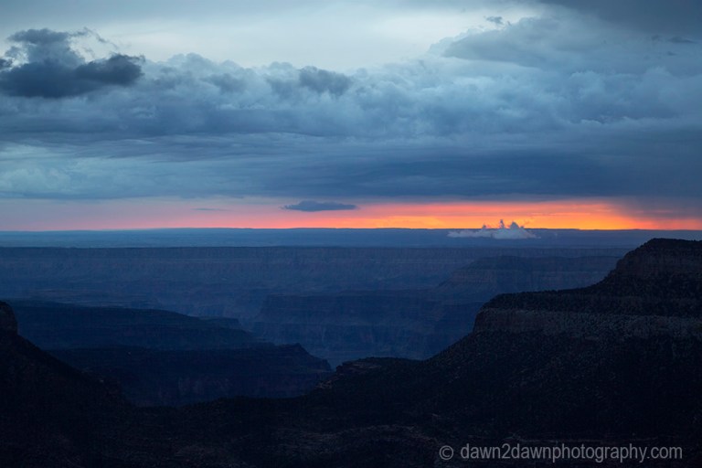 Storm clouds pass over the Grand Canyon near sunset as seen from Timp Point, Kaibab National Forest, Arizona