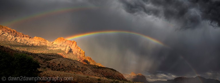 A rainbow appears during a monsoonal thunderstorm at Zion National Park, Utah