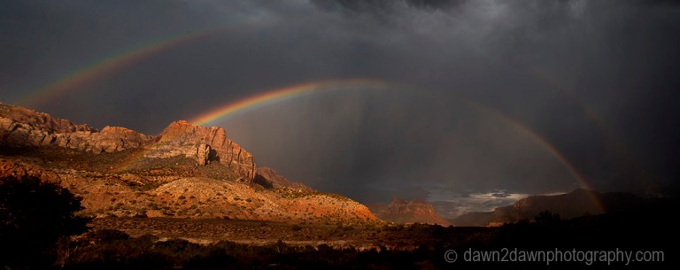 A rainbow appears during a monsoonal thunderstorm at Zion National Park, Utah