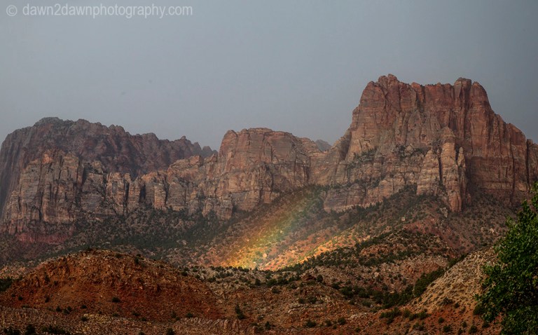 A rainbow appears during a monsoonal thunderstorm at Zion National Park, Utah