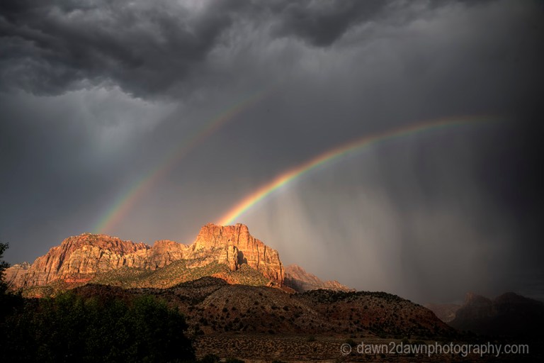 A rainbow appears during a monsoonal thunderstorm at Zion National Park, Utah