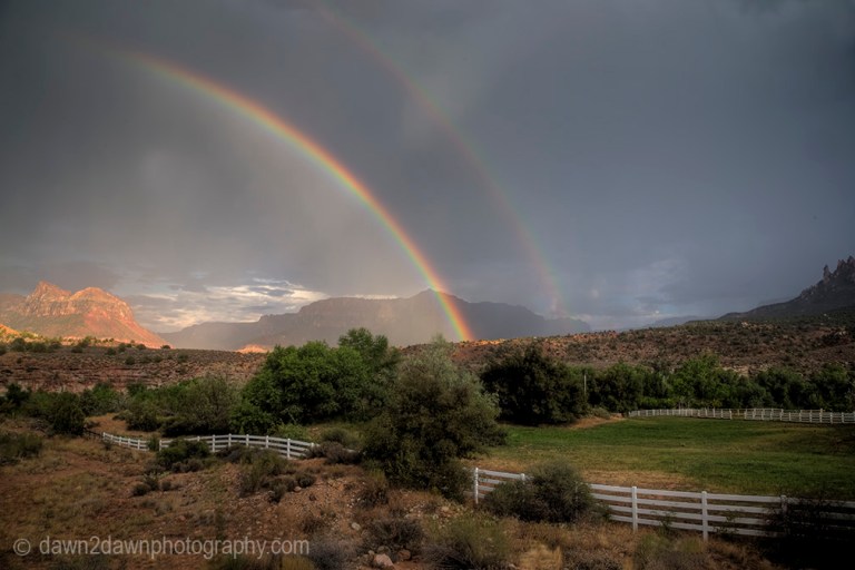 A rainbow appears during a monsoonal thunderstorm at Zion National Park, Utah