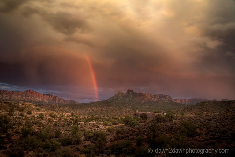 A rainbow appears during a monsoonal thunderstorm at Zion National Park, Utah