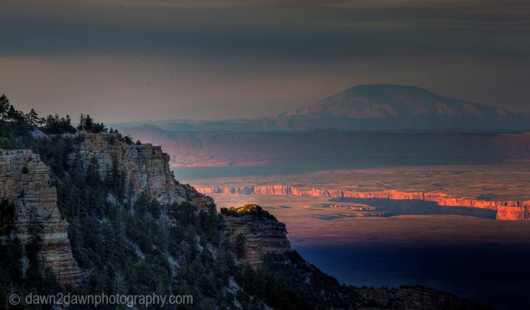 The light from the setting sun shines on Marble Canyon at Grand Canyon National Park, Arizona.