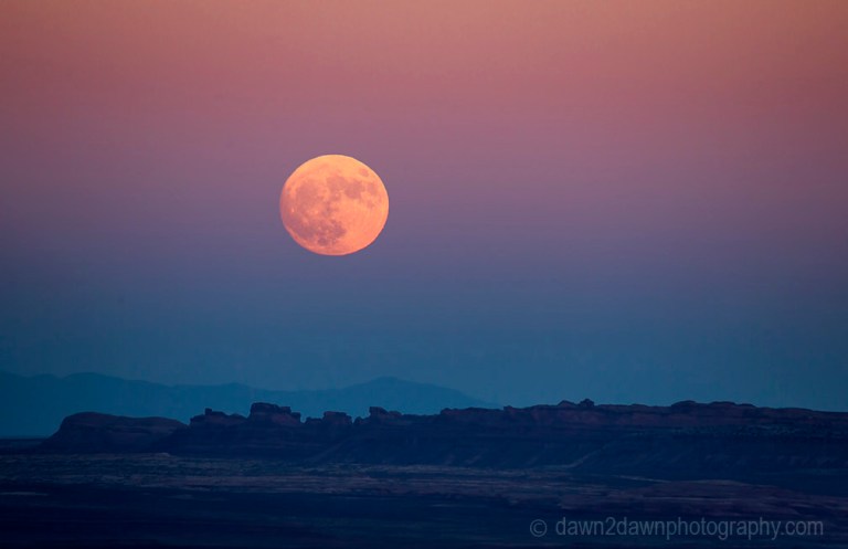 The full moon or supermoon rises over Monument Valley on Navajo Tribal Land on the Utah/Arizona border.
