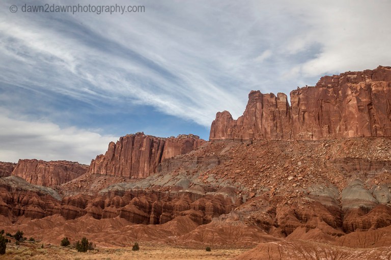 Unusual sandstone rock formations are seen along Utah's rural Highway 24 at Capitol Reef National park.