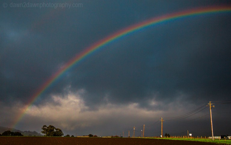 A rainbow appears just after a rainstorm in rural California