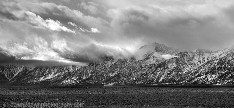 The snow-covered Sierra Nevada Mountains are the predominate feature at Owens Valley, California