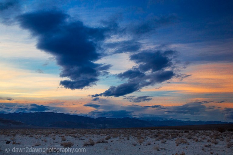 Threatening clouds pass over Eureka Valley during sunset at Death Valley National Park, California