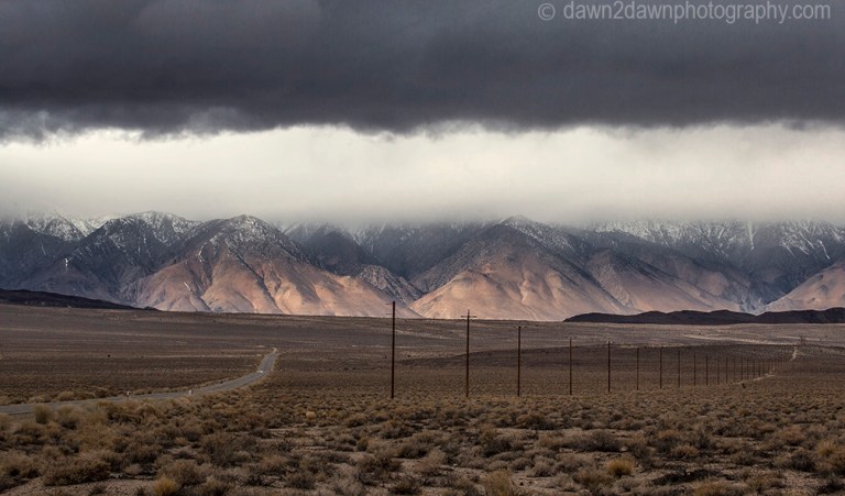 The snow-covered Sierra Nevada Mountains are the predominate feature at Owens Valley, California